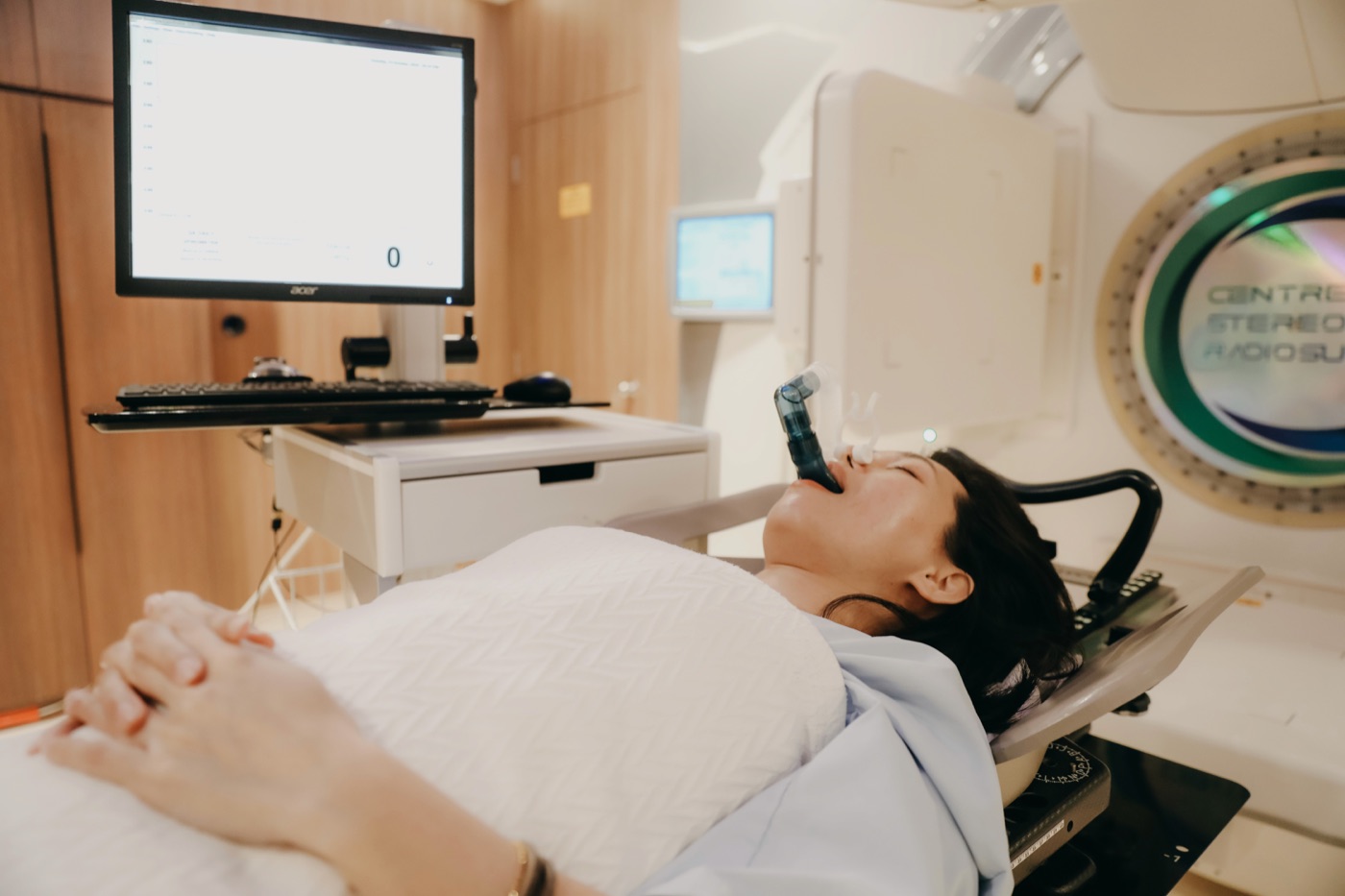 Patient using the Active Breathing Coordinator during heart-sparing radiotherapy